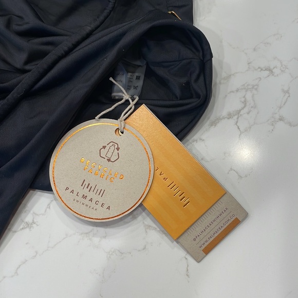 Palmacea, one piece, tied swimsuit with cut outs.  
Size M - Picture 7 of 12